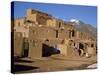 Woman Sweeping Up, in Front of the Adobe Buildings, Dating from 1450, Taos Pueblo, New Mexico, USA-Westwater Nedra-Stretched Canvas