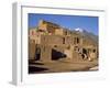 Woman Sweeping Up, in Front of the Adobe Buildings, Dating from 1450, Taos Pueblo, New Mexico, USA-Westwater Nedra-Framed Photographic Print