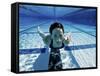 Woman Swimming Underwater in a Swimming Pool-null-Framed Stretched Canvas