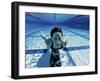 Woman Swimming Underwater in a Swimming Pool-null-Framed Photographic Print