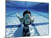 Woman Swimming Underwater in a Swimming Pool-null-Mounted Photographic Print