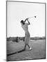 Woman Swinging Golf Club-Philip Gendreau-Mounted Photographic Print