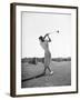Woman Swinging Golf Club-Philip Gendreau-Framed Photographic Print