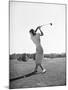 Woman Swinging Golf Club-Philip Gendreau-Mounted Photographic Print