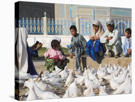 Woman Taking Photograph of Family Squatting on a Wall, Mazar-I-Sharif, Afghanistan-Jane Sweeney-Stretched Canvas