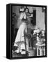 Woman Talking on Wall Mounted Telephone-null-Framed Stretched Canvas