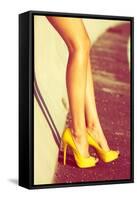 Woman Tan Legs In High Heel Yellow Shoes Outdoor Shot Summer Day-coka-Framed Stretched Canvas
