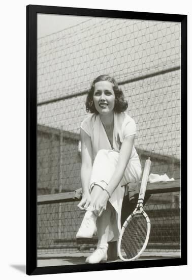 Woman Tennis Player Adjusting Stocking-null-Framed Art Print