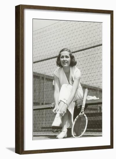 Woman Tennis Player Adjusting Stocking-null-Framed Art Print