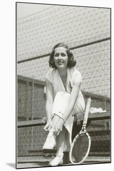 Woman Tennis Player Adjusting Stocking-null-Mounted Art Print