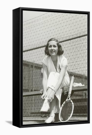 Woman Tennis Player Adjusting Stocking-null-Framed Stretched Canvas