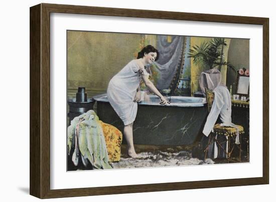 Woman Testing Water Temperature in Bathtub-null-Framed Giclee Print