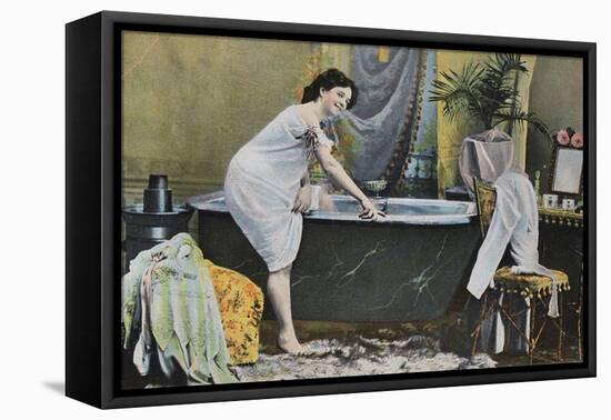 Woman Testing Water Temperature in Bathtub-null-Framed Stretched Canvas