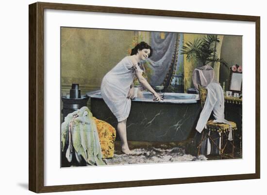 Woman Testing Water Temperature in Bathtub-null-Framed Giclee Print