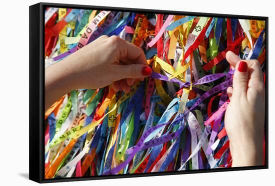 Woman Tying Lucky Ribbon at Igreja Nosso Senhor do Bonfim Church, Salvador, Bahia, Brazil-Yadid Levy-Framed Stretched Canvas