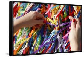 Woman Tying Lucky Ribbon at Igreja Nosso Senhor do Bonfim Church, Salvador, Bahia, Brazil-Yadid Levy-Framed Stretched Canvas