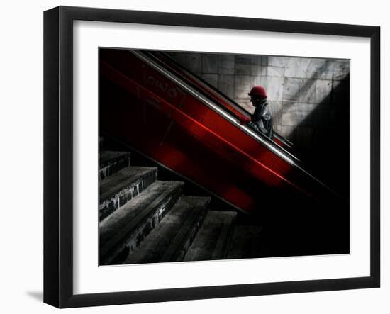 Woman Uses an Escalator at a Pedestrian Underpass in Belgrade, Serbia-null-Framed Photographic Print