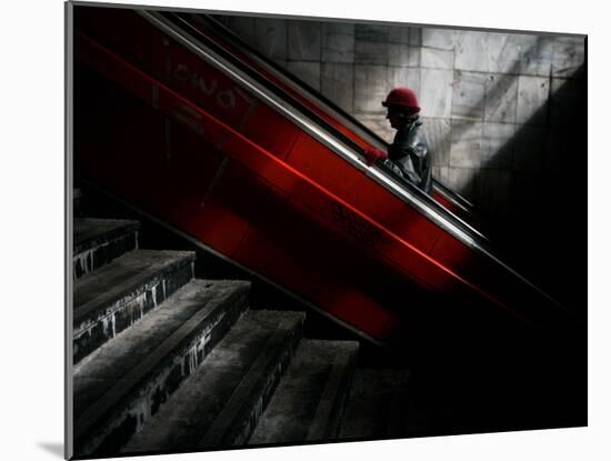 Woman Uses an Escalator at a Pedestrian Underpass in Belgrade, Serbia-null-Mounted Photographic Print