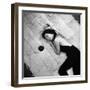 Woman using pearls and seashell covered back scratcher across white plush rug-Yale Joel-Framed Photographic Print