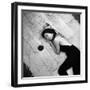 Woman using pearls and seashell covered back scratcher across white plush rug-Yale Joel-Framed Photographic Print