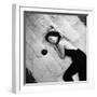 Woman using pearls and seashell covered back scratcher across white plush rug-Yale Joel-Framed Photographic Print