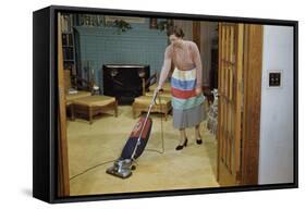 Woman Vacuuming Living Room-William P. Gottlieb-Framed Stretched Canvas