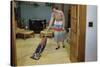 Woman Vacuuming Living Room-William P. Gottlieb-Stretched Canvas