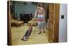 Woman Vacuuming Living Room-William P. Gottlieb-Stretched Canvas