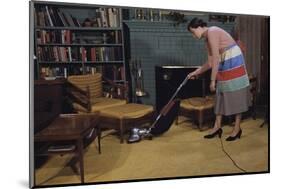 Woman Vacuuming Living Room-William P. Gottlieb-Mounted Photographic Print