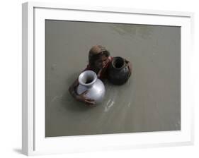 Woman Wades Through Flood Waters to Collect Drinking Water at Kakadhowa Village in India-null-Framed Photographic Print