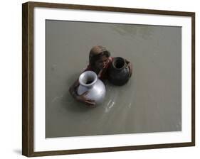 Woman Wades Through Flood Waters to Collect Drinking Water at Kakadhowa Village in India-null-Framed Photographic Print