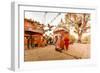 Woman walking and praying with pigeons at the hilltop temple, Bhaktapur, Kathmandu Valley, Nepal, A-Laura Grier-Framed Photographic Print