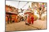 Woman walking and praying with pigeons at the hilltop temple, Bhaktapur, Kathmandu Valley, Nepal, A-Laura Grier-Mounted Photographic Print