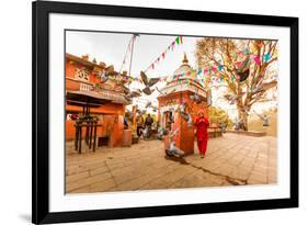 Woman walking and praying with pigeons at the hilltop temple, Bhaktapur, Kathmandu Valley, Nepal, A-Laura Grier-Framed Photographic Print