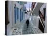 Woman Walking Down an Alley, Mykonos Town, Mykonos, Greece-Doug Pearson-Stretched Canvas