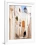 Woman walking in a narrow street in the Old Town, Locorotondu, Puglia, Italy, Europe-Karen Deakin-Framed Photographic Print