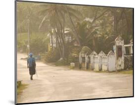 Woman Walking in Sea Mist, Bathsheba, Barbados-Walter Bibikow-Mounted Photographic Print