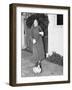 Woman Walking in the Rain with a Duck on a Leash-null-Framed Photo