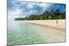 Woman Walking on a Palm Fringed White Sand Beach in Ha'Apai Islands, Tonga, South Pacific-Michael Runkel-Mounted Photographic Print