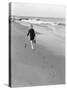 Woman Walking on Beach Leaving Footprints-Philip Gendreau-Stretched Canvas