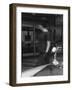 Woman Walking Past a Rolls-Royce-null-Framed Photographic Print