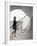 Woman walking up staircase holding handrail-John Edward Linden-Framed Photo