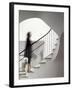 Woman walking up staircase holding handrail-John Edward Linden-Framed Photo