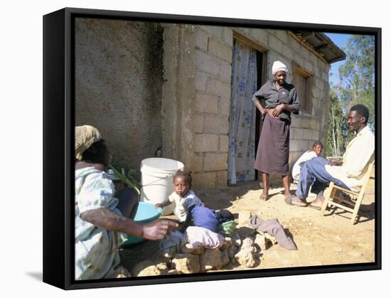 Woman Washing Clothes Outside Shack, Godet, Haiti, Island of Hispaniola-Lousie Murray-Framed Stretched Canvas