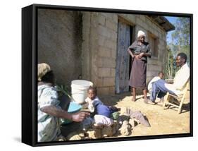 Woman Washing Clothes Outside Shack, Godet, Haiti, Island of Hispaniola-Lousie Murray-Framed Stretched Canvas