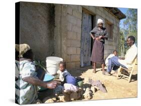 Woman Washing Clothes Outside Shack, Godet, Haiti, Island of Hispaniola-Lousie Murray-Stretched Canvas