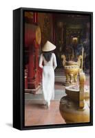 Woman Wearing Ao Dai Dress at Ha Chuong Hoi Quan Pagoda, Cholon, Ho Chi Minh City, Vietnam-Ian Trower-Framed Stretched Canvas