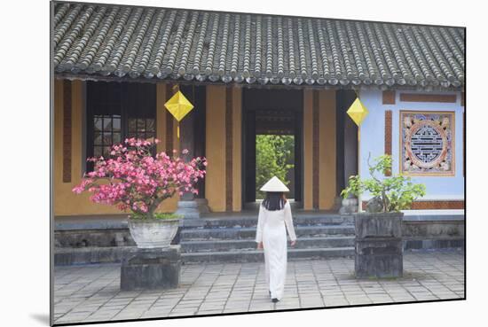Woman Wearing Ao Dai Dress at Left House Inside Citadel, Hue, Thua Thien-Hue, Vietnam, Indochina-Ian Trower-Mounted Photographic Print
