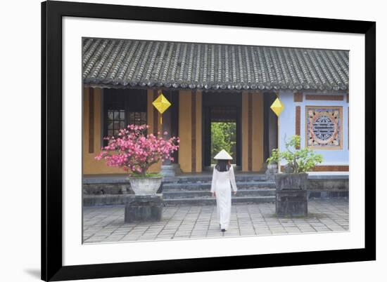 Woman Wearing Ao Dai Dress at Left House Inside Citadel, Hue, Thua Thien-Hue, Vietnam, Indochina-Ian Trower-Framed Photographic Print