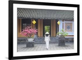 Woman Wearing Ao Dai Dress at Left House Inside Citadel, Hue, Thua Thien-Hue, Vietnam, Indochina-Ian Trower-Framed Photographic Print